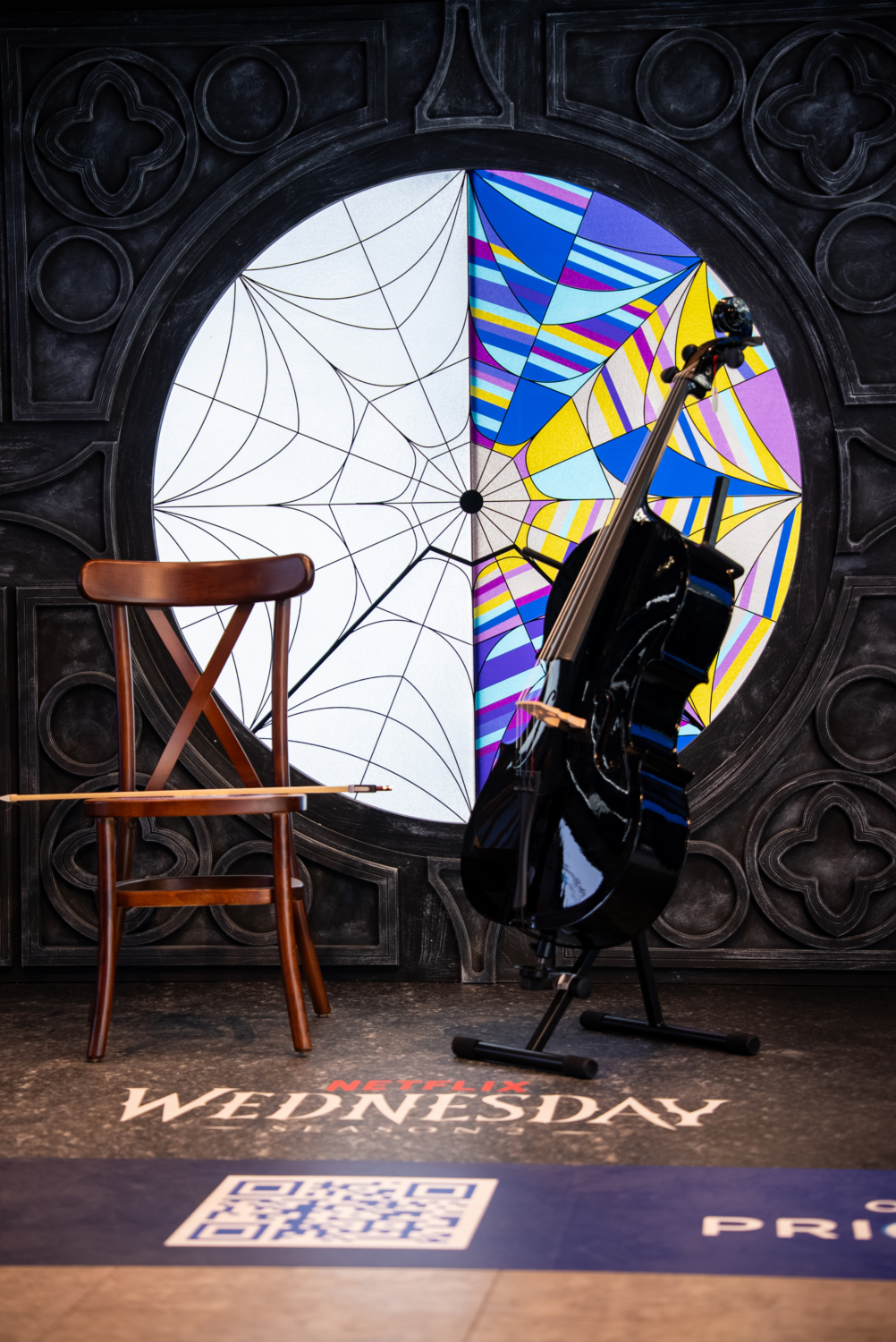Visitors explore immersive Wednesday-themed installations at the O2 Connected Lifestyle space, featuring gothic props and atmospheric lighting.